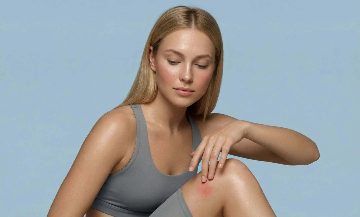 Woman tending to her knee after activity